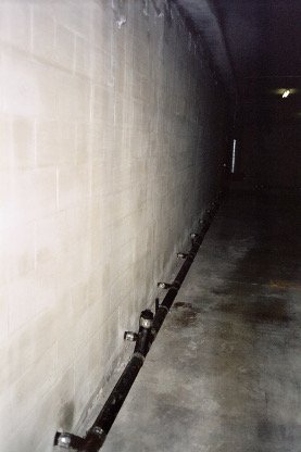 Subterranean garage foundation drainage cores drilled