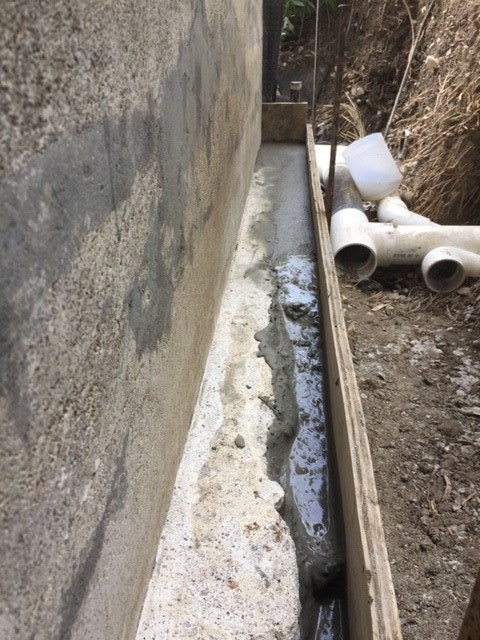 Surface grinding foundation required for waterproofing adhesion