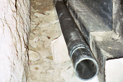 Foundation french drain wrapped with filter fabric