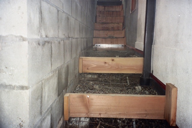 Concrete poured to hill side step forms