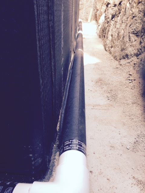 French Drains Wrapped in Filter Fabric With Edges Sealed With Tape