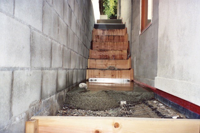 Forms installed for concrete steps on hill side property