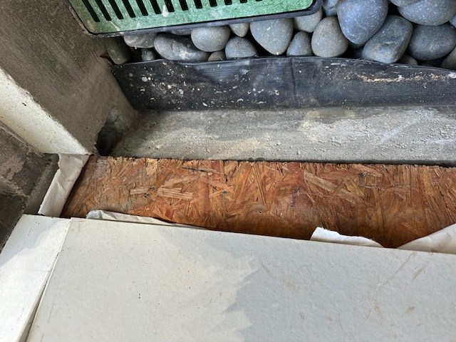 Foundation water intrusion at sill plate connection allowing water to migrate into interior creating water damage
