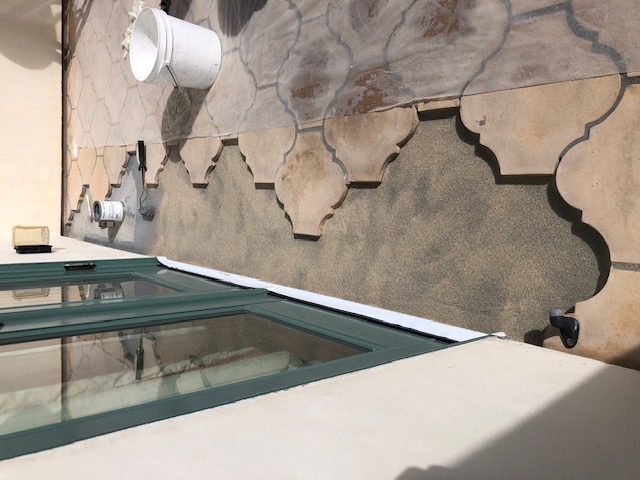 Waterproofing membrane applied over deck sloping mortar bed”