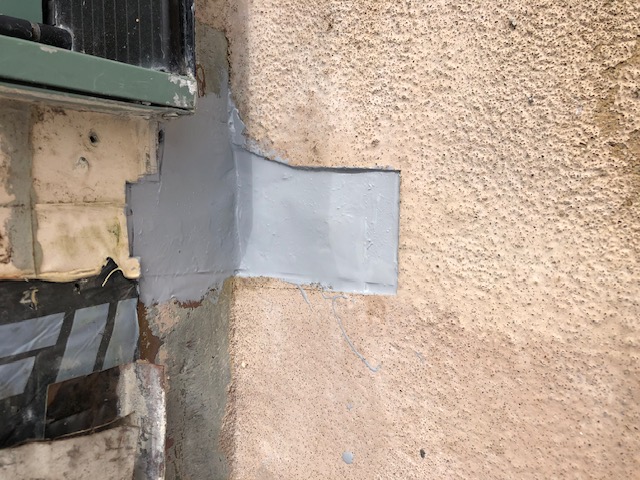 Waterproofing membrane applied over copper deck flashing correction area