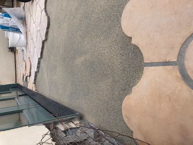 Secondary waterproofing membrane applied over deck sloping mortar bed restoration area