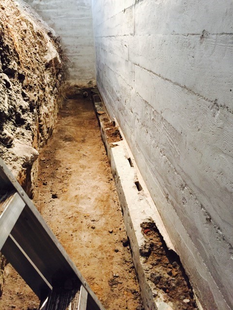 Defective footing creating basement leaks