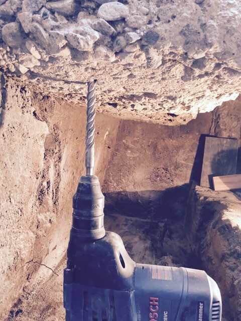Drilling cores under foundation for rebar reinforcements