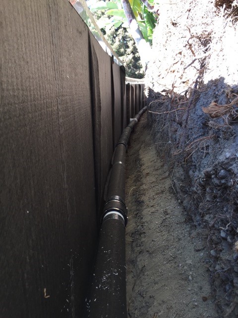 Planter french drains in curved profile