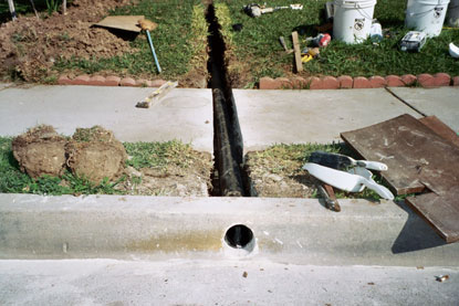 Drainage pipe sloped to street curb