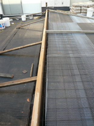 Cement forms installed to step transition prior to sloping cement application