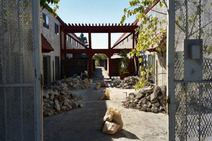Concrete slab located above elevated deck waterproofing system requiring removal